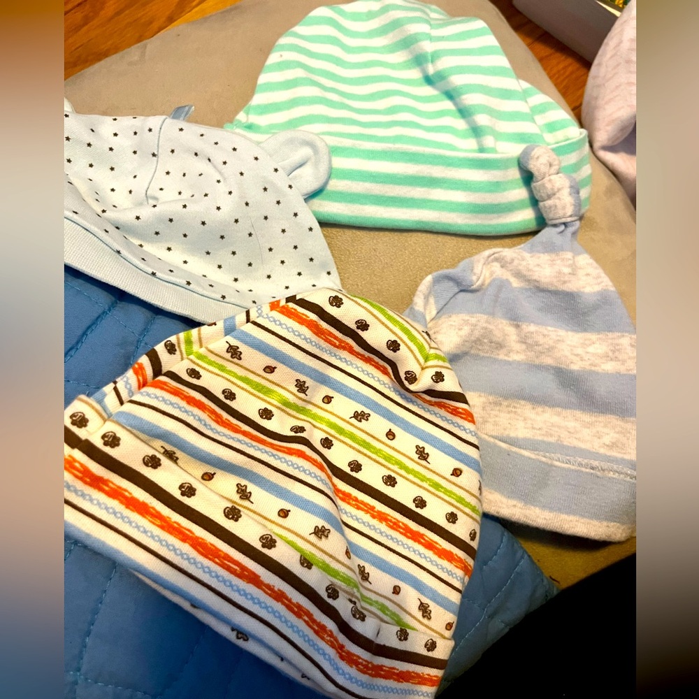 Four infant hats -3 new and one like new
